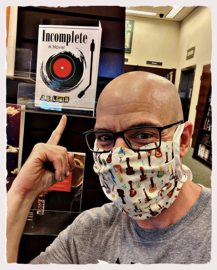 Joel Levin taking a selfie on Instagram with his newly stocked book, Incomplete, in Barnes and Noble.