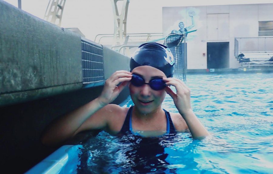 New swimmer Morgan Velasco takes a short break for a picture during morning practice.