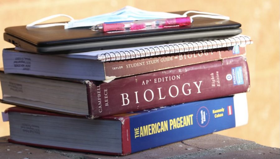 The AP Endeavor. As we continue with the 2021-2022 school year, the AP textbooks pile high for classes such as AP Biology and AP US History. After a year online, students must adapt back to life on campus and to their APs. For some, this has been a struggle. The pandemic enabled kids to learn how to cut corners and that has really affected their learning and their work ethic now that we are back in person, AP Biology teacher Cody Foster said.
