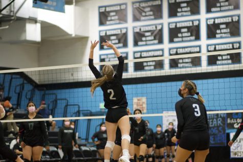 Senior Teagan Mills jumps to the get ball over the net to get the next point for the Buena Bulldog’s, against Pacifica Oct. 7
