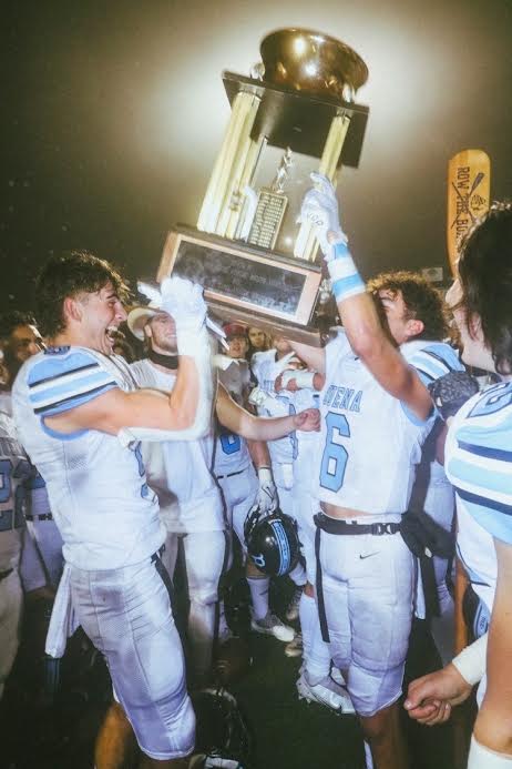 Seniors Jackson Geier and Manny Mendez hoisting the Suzanne Brown trophy Oct. 25 after their turning point game, when they beat their longtime, crosstown rivals, the Ventura Cougars.