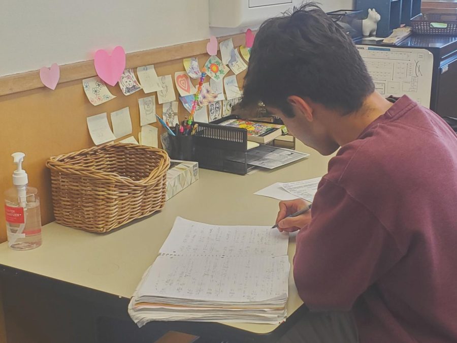 Joshua Alcantar studies hard while in his fourth period office assistance program.