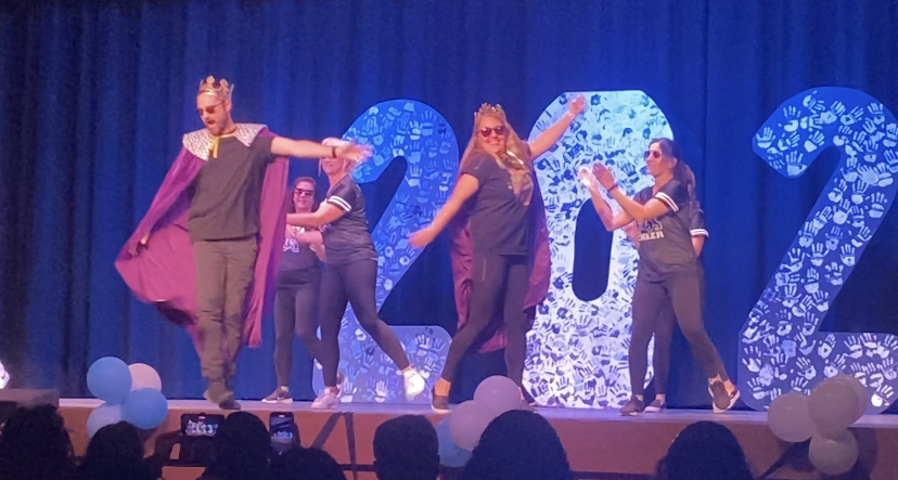 Cody and Aimee Foster, biology and special-ed teachers respectively, are two dancing queens at the school Renaissance rally. 