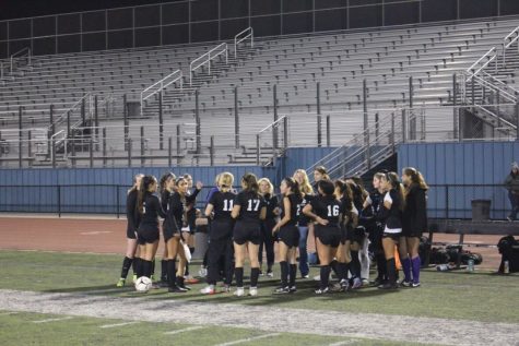 The Buena girls varsity soccer team during half time. The girls are coached by head coach Amanda Tewes, and assistant coaches David Vallejo and Trisha Butterbaugh.