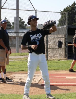 Sophomore varsity starter Elijah Garcia warms up for his upcoming pre season games to be Buena High Schools catcher.