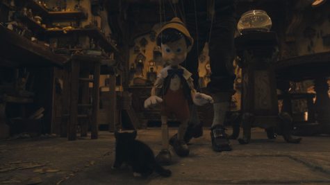 Pinocchio being puppeteered by Geppeto before he is magically turned alive. 