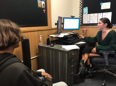 Maciel assists Sophomore Sam Feltner with class schedule. We talk with students about struggles they are facing and try to help as best as we can to get through that, Maciel said.