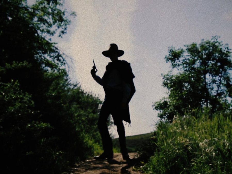 A screenshot from "The Man With the Six Shooter," showing Luke Rowley.