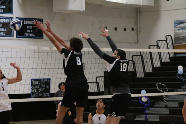 Buena number 9, Josh Toll, and number 18, Moises Lantigua, blocks a spike from Ventura High School.