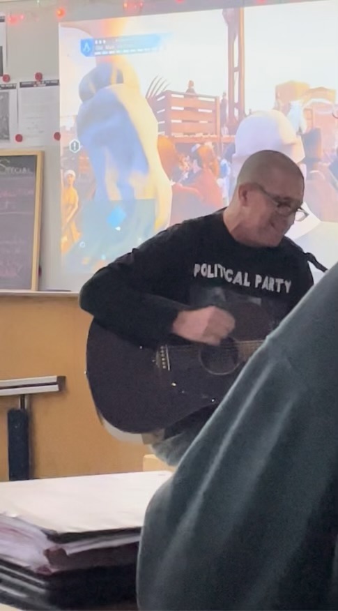 Giannelli plays guitar for his AP European History class.