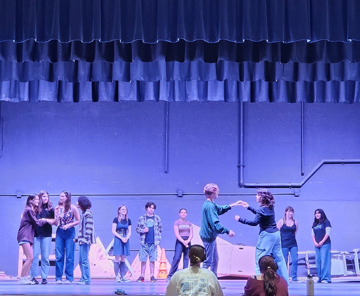 Buena's drama department rehearses the fall play in the auditorium. Ichabod Crane (Chase Dykeman) is dancing with Katrina Van Tassel (Kai Wyatt). Spirits are high and the cast is enthused. 