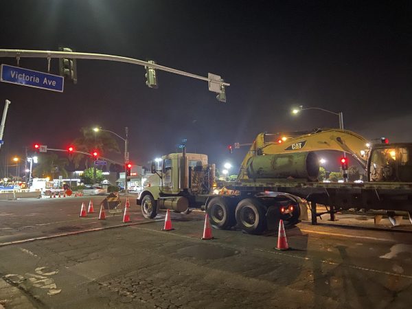  Late night construction works to replace a city waterline, with most of the work being done late at night and spills into the early morning hours. 
