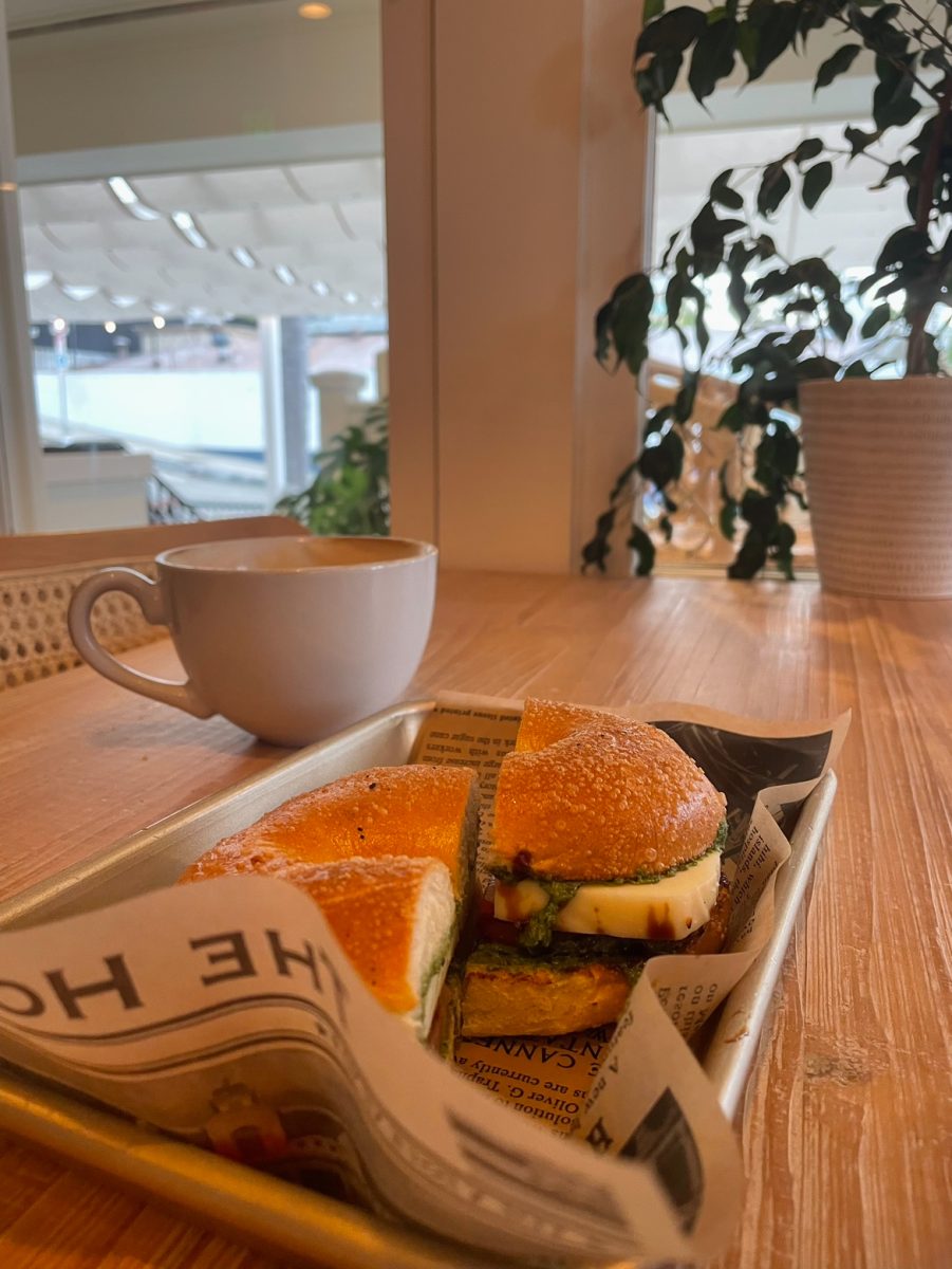 Bagel sandwich with a lavender latte