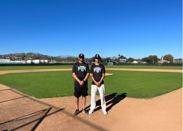 Senior Kaelan Davis (right) poses with Buena Baseball's new head coach, Bryson Wallet (left) on Buena's baseball field.