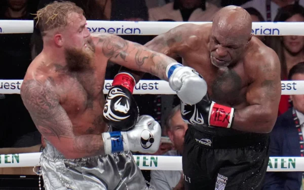 Jake Paul (Left) and Mike Tyson (Right) both landing hits on each other during the match