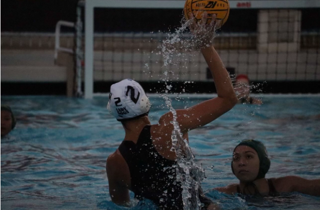 Sophomore Maren Bursek looks to the cage to boost Buena's offense.