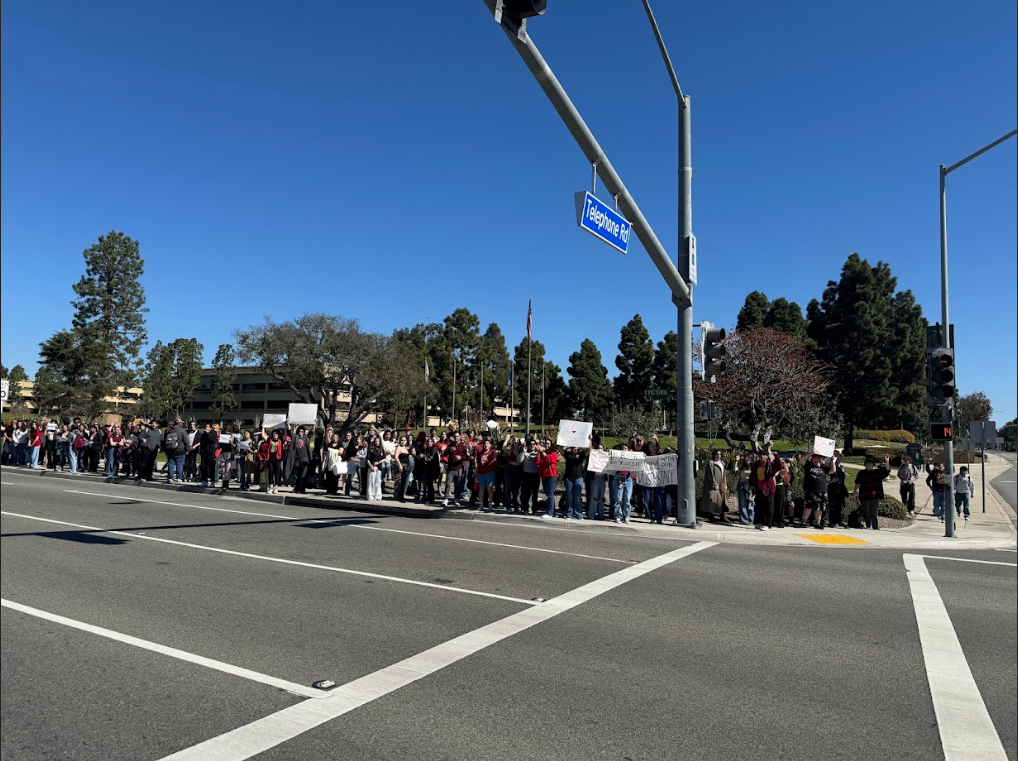 Students gather on the corner of Telephone and Victoria, peacefully protesting and sharing their voices.