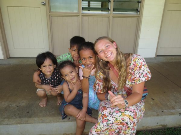 Lyndie Brown (right corner) with children in  Apia Samoa, who she helped build a Medical Center for.