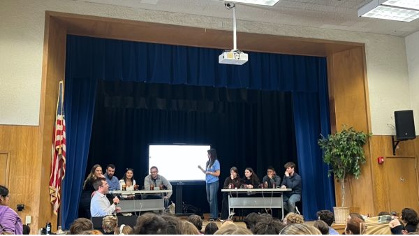Knowledge bowl participants preparing to face off in the annual teacher vs. student Knowledge Bowl, April 17.