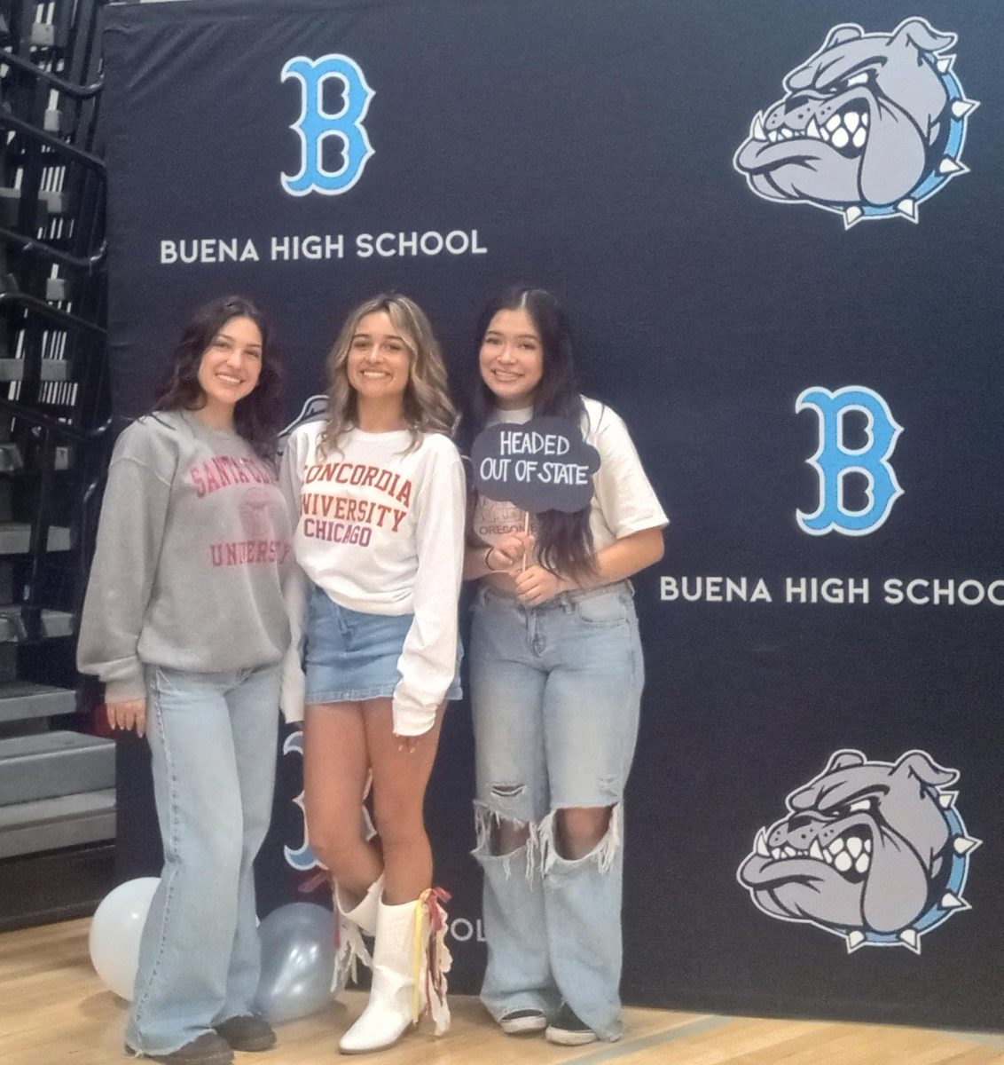 Seniors pose in front of Buena backdrop. From left to right: Kimberly Chavarria, Reagan Espinoza, Yuliana Quiroz