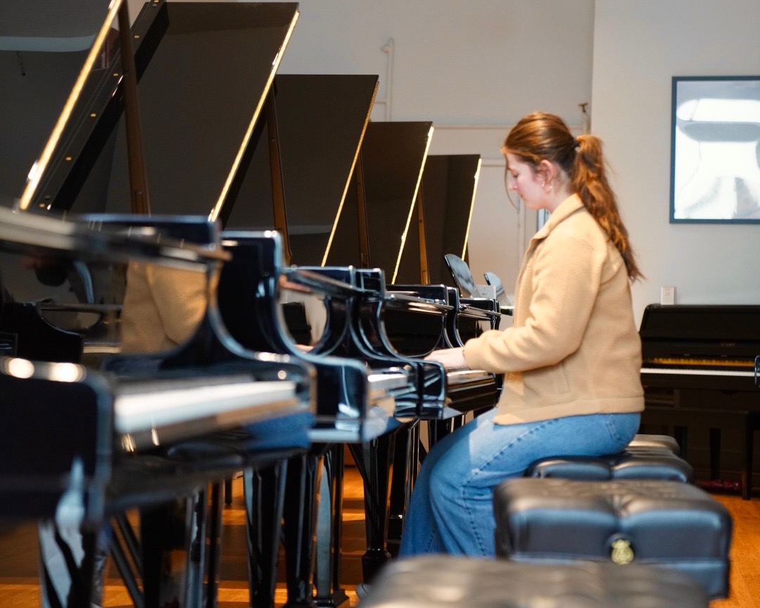 Alex Levin swept up in the music, playing piano.