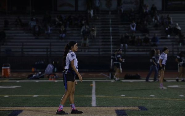 Sitlali Garcia preparing for the flag football game to start, and getting into beast mode
