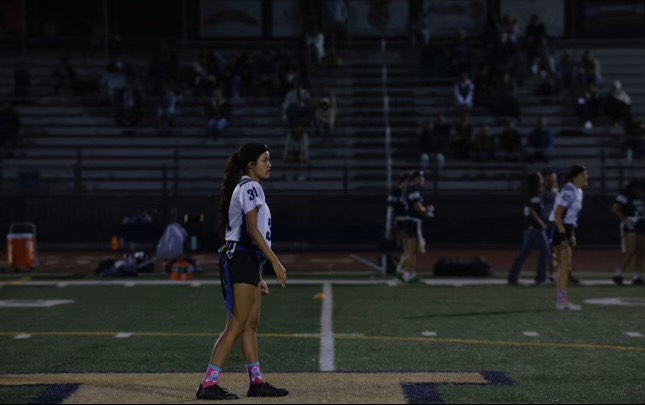 Sitlali Garcia preparing for the flag football game to start, and getting into beast mode