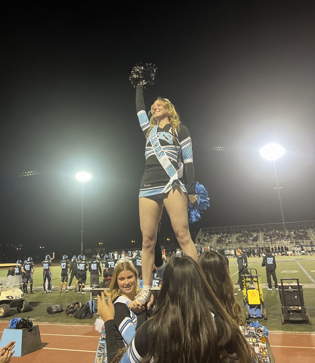 Berry cheers on the Bulldogs during senior night. 