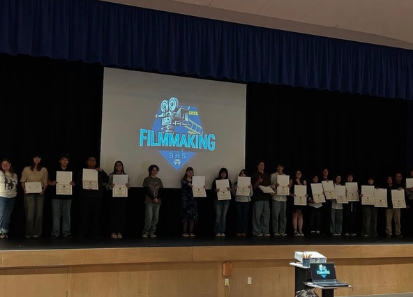 The winners of the short film awards accept their certificates. 