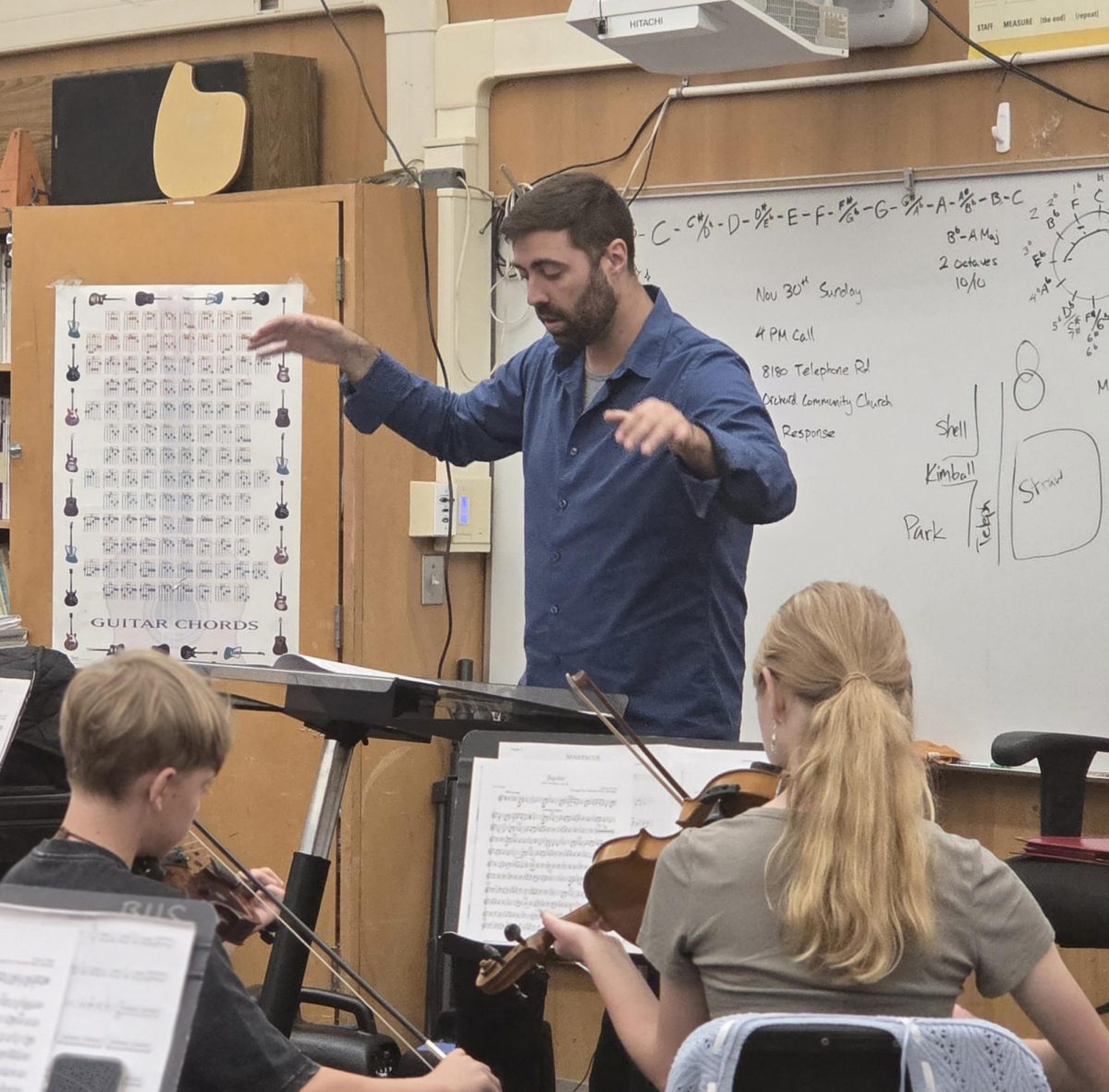 Tim MacDonald conducting his Strings One ensemble