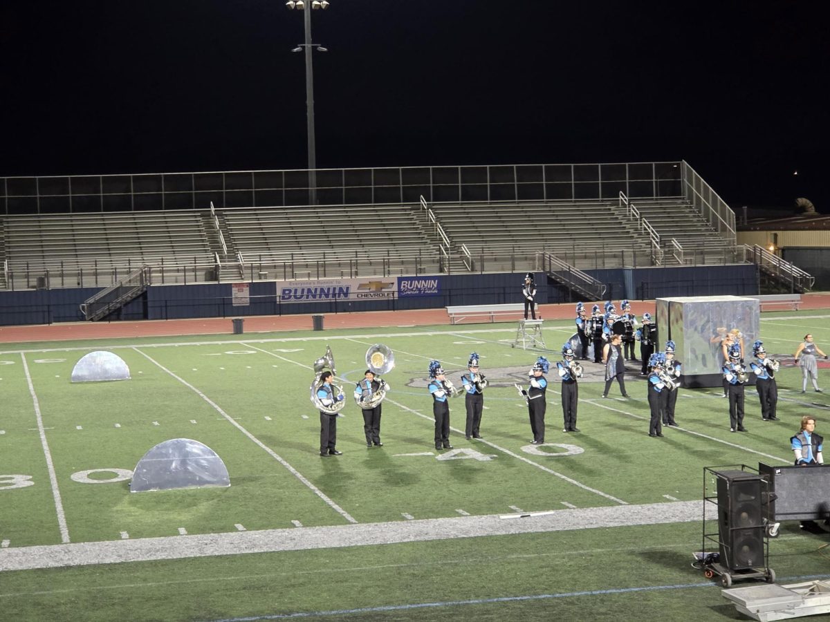 Buena's marching band warms up before the performance on the field.
