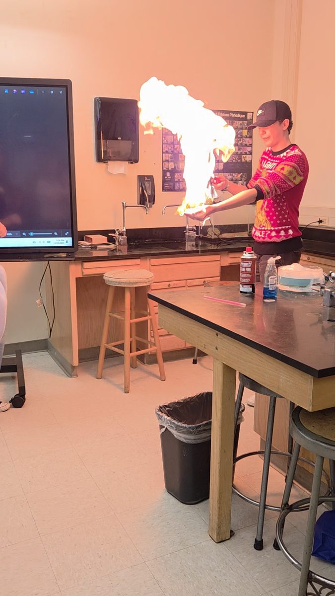 The popular flaming hand experiment, as demonsrated by a student.