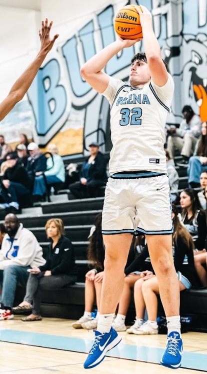 Senior Rook Johnson takes a shot from the sidelines in hope to land some more points on the board.