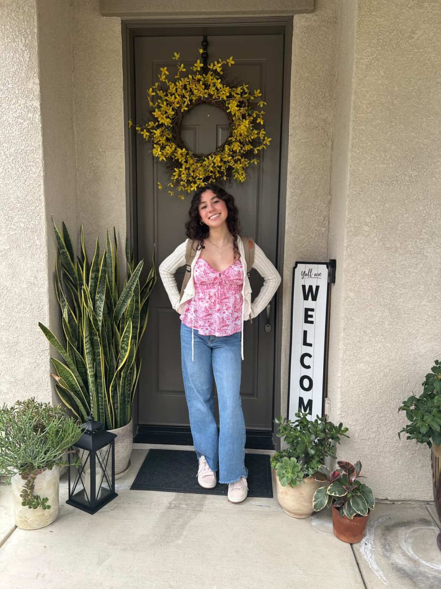  Mia Martinez taking a back-to-school photo for Senior year.