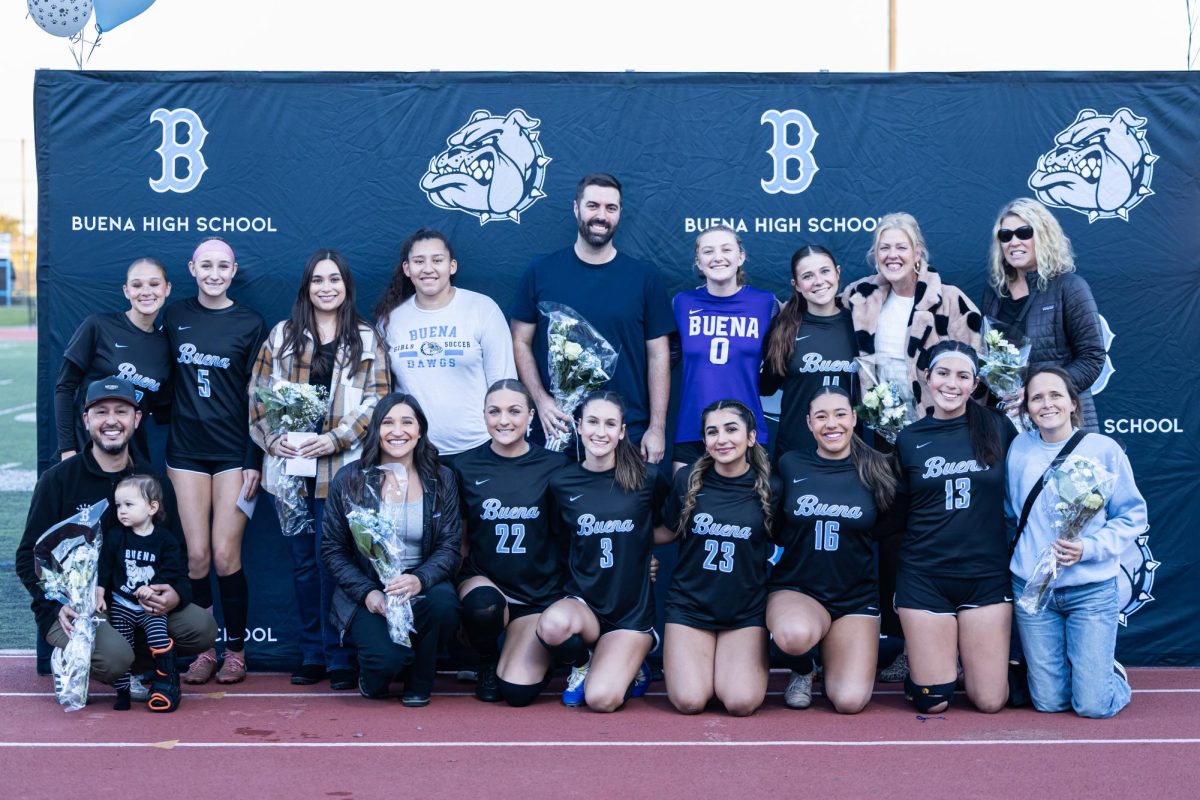 Photo of all the staff members acknowledged by varsity players before the game started.