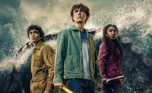 Walker Scobell, Aryan Simhadri, and Leah Jefferries standing against a storm in character.