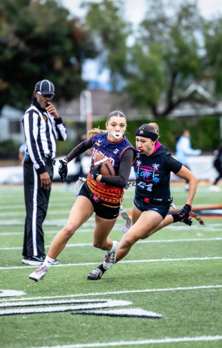 Wide receiver Sydney Pena runs towards the end zone on a quick pass given by the quaterback.