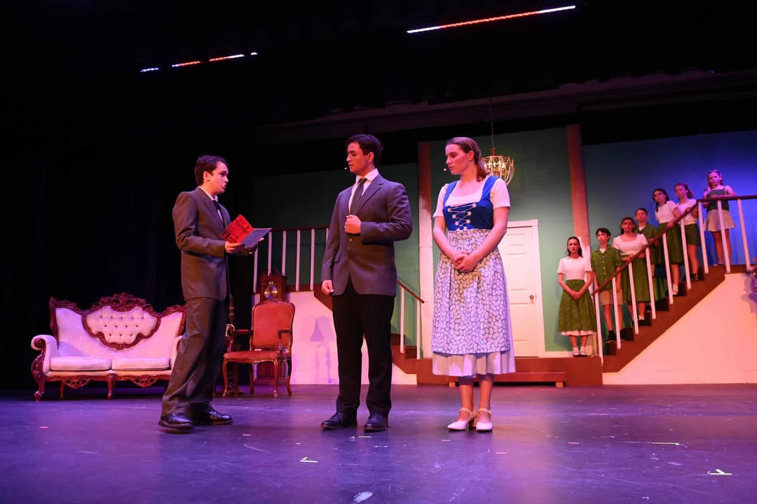 Nic Faught center stage playing Captain Von Trapp in "The Sound of Music".