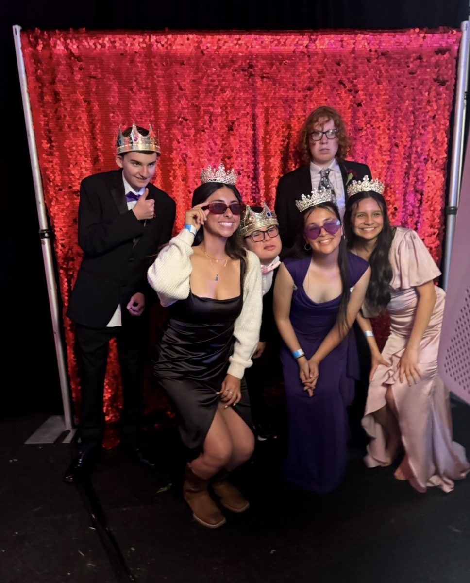 Night to Remember attendees are all smiles for the photo booth (from left to right:  Nickolas Leaskas, Rocky Flores, Benjamin Devericks, Sarah Gazi, Nicholas White and Jaylee Rayes. 