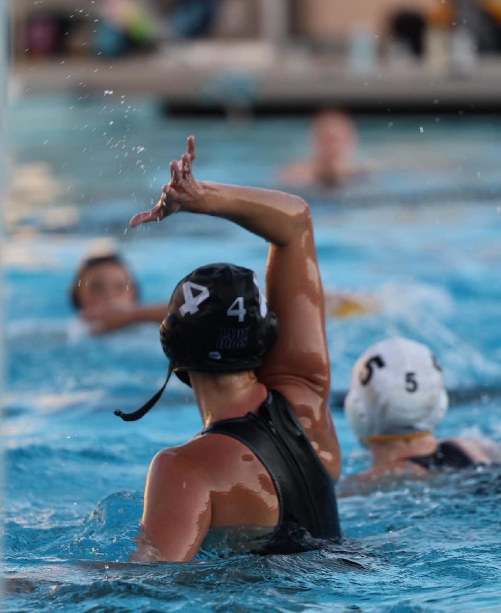 Avery Buehner shines in the pool, whether as co-captain of the team, or as a stellar player.