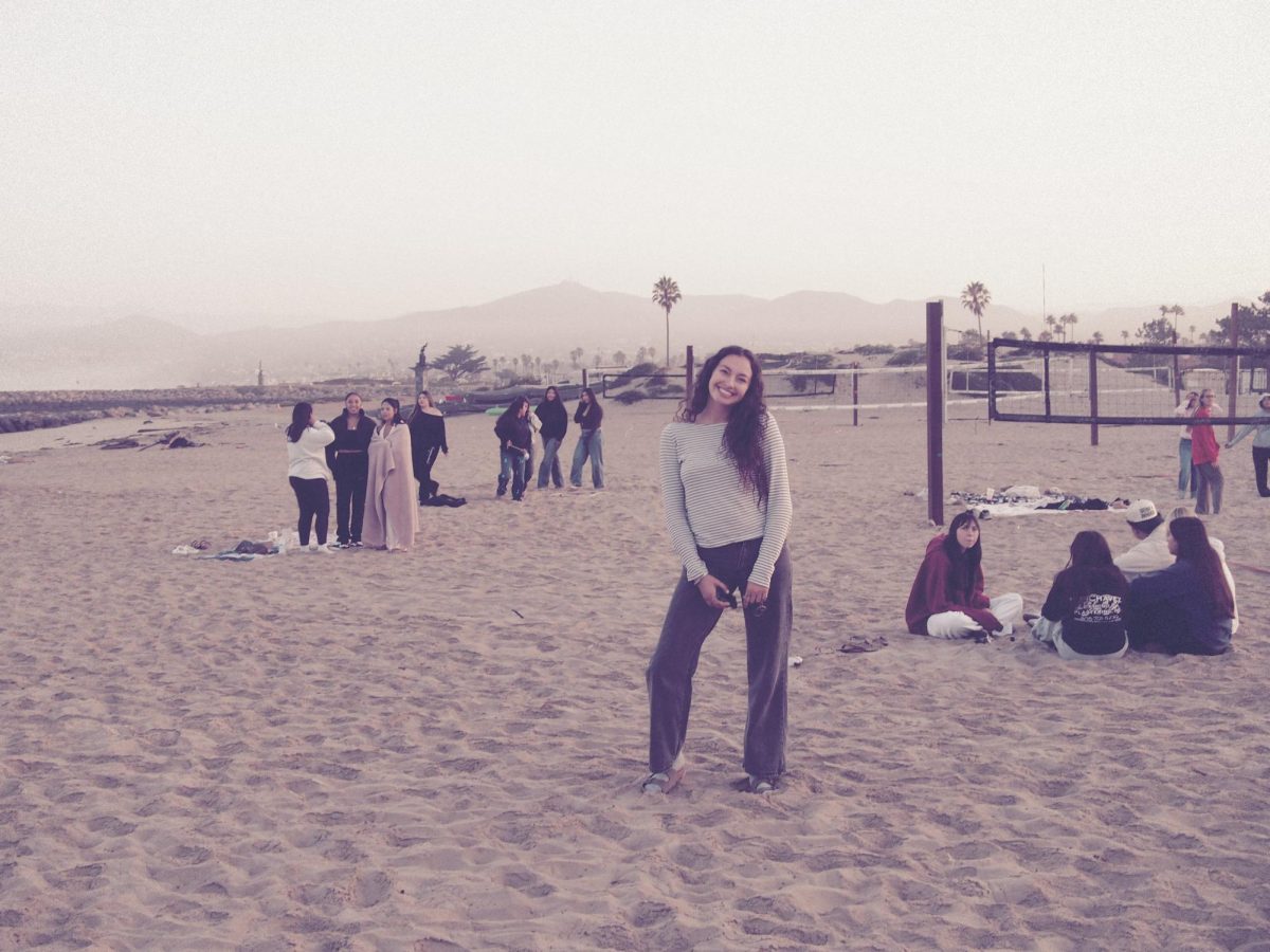 Naima Dickerson posing on a beach for Buena High School's Senior Sunrise.