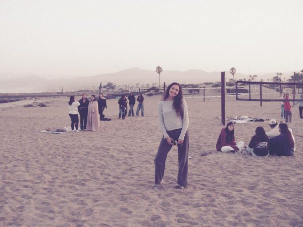 Naima Dickerson posing on a beach for Buena High School's Senior Sunrise.