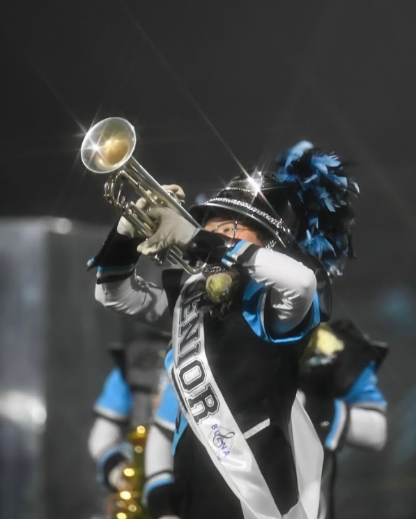 McGovern plays the trumpet with the Buena marching band on senior night.