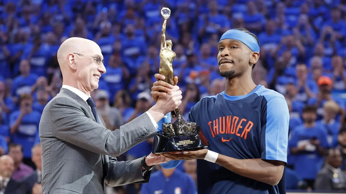 SGA getting his MVP trophy from Adam Silver.